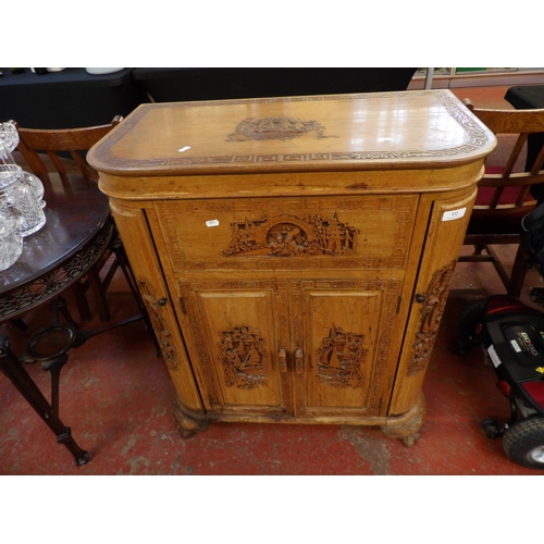 332 - An oriental hard wood bar counter with profuse carved decoration and lifting top