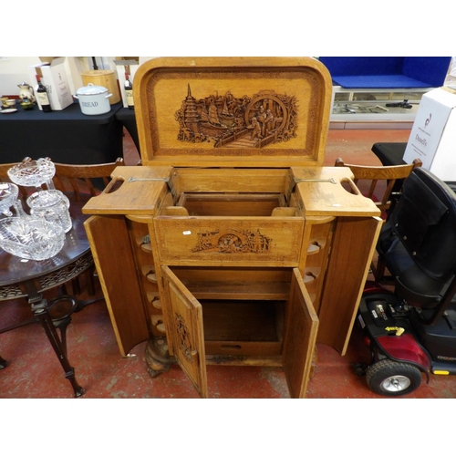 332 - An oriental hard wood bar counter with profuse carved decoration and lifting top