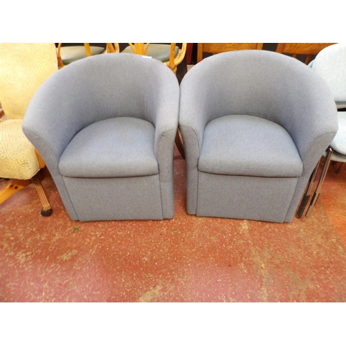 335 - A pair of tub chairs upholstered in blue fleck design fabric