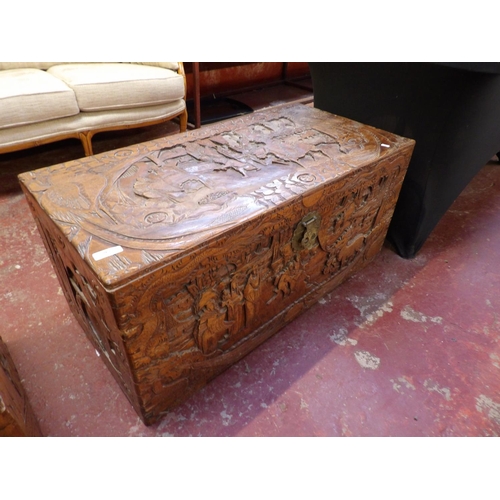 362 - A vintage camphor wood chest with profuse carved decoration