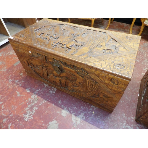 363 - A vintage camphor wood chest with profuse carved decoration