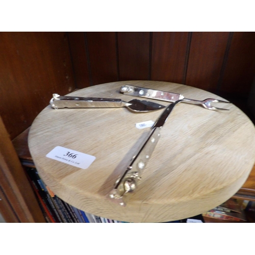 366 - A wooden cheese board together with cheese implements adorned with mice