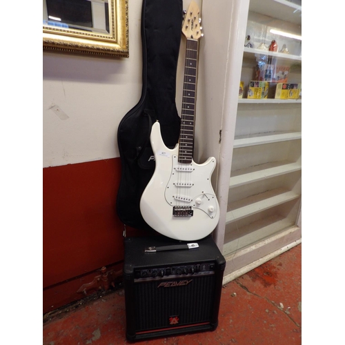 427 - A Peavey electric guitar and case together with a Peavey Rage 158 amplifier