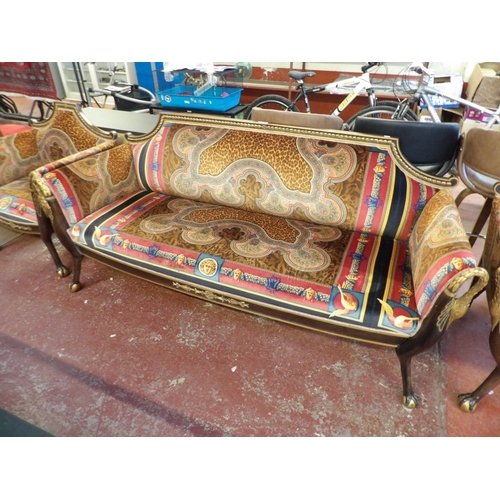 178 - A four piece salon suite with gilded decoration and modelled in the Egyptian style and upholstered i... 