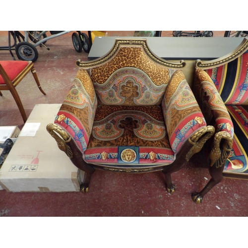 178 - A four piece salon suite with gilded decoration and modelled in the Egyptian style and upholstered i... 