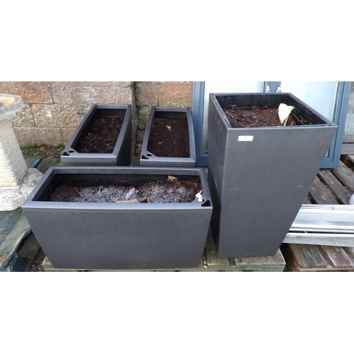 38 - A set of three rectangular planters together with a similar square planter of tapered form