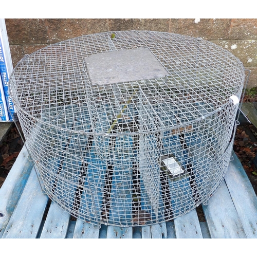 41 - A galvanised mesh animal trap of circular form