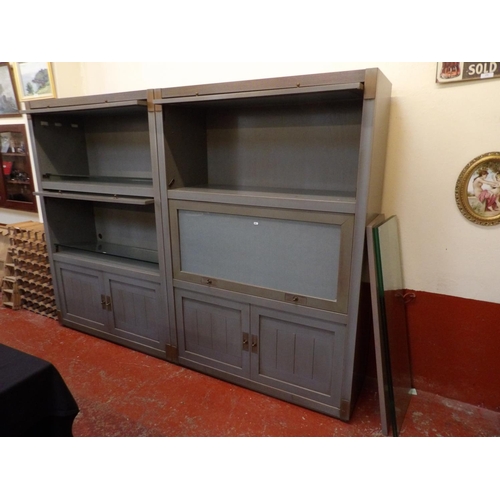 190 - A pair of part glazed lounge cabinets in distressed finish