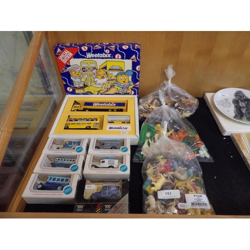 193 - A selection of boxed diecast model vehicles together with a quantity of play animals