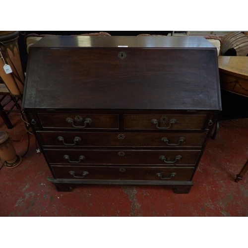 260 - A George III mahogany fall front bureau the fall concealing a fully fitted interior