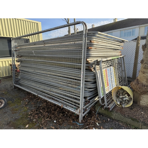 19 - A large assortment of galvanised site fencing complete with clips and bases