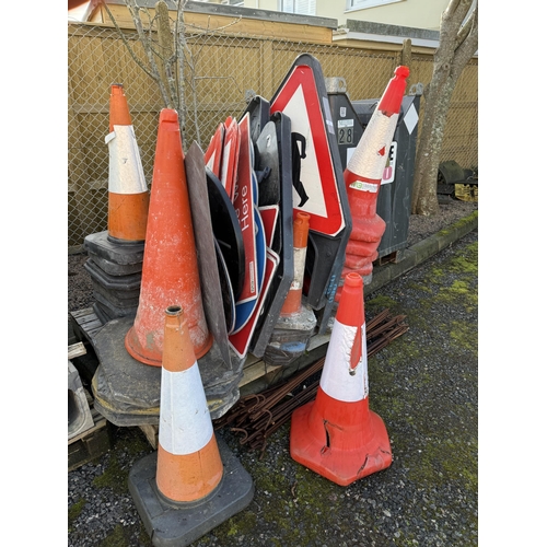 25 - Assorted road work warning signs, a convex entrance mirror, traffic cones, steel stakes etc.