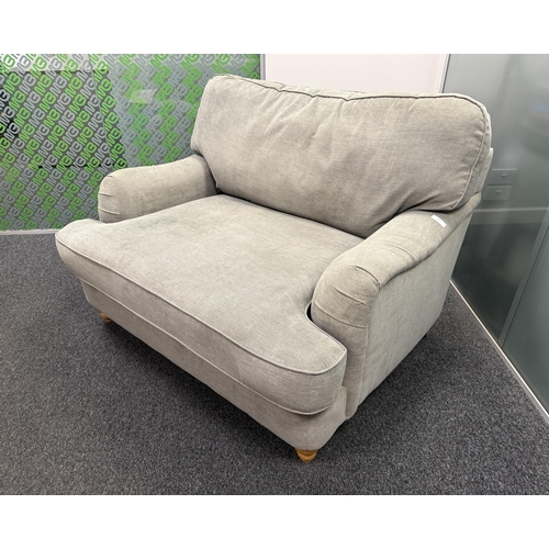 327 - An easy chair upholstered in grey coloured fabric of large proportion