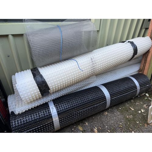 51 - Four rolls of waterproofing membrane together with a small roll of plastering mesh