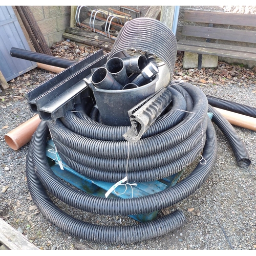 30 - A large coil of land drainage pipe together with other drain fittings