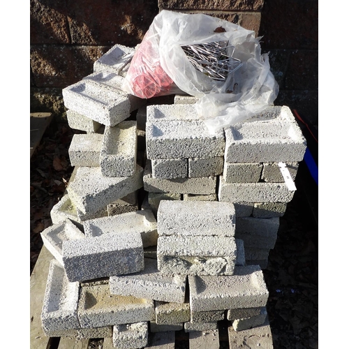 48 - A quantity of concrete blocks complete with wall ties