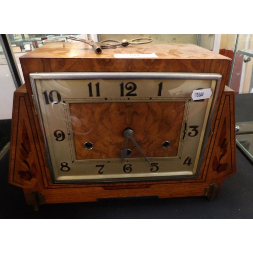 301 - An Art Deco burr walnut cased mantle clock with marquetry inlay