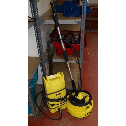 122 - A Karcher K2.25 pressure washer complete with scrubber attachment