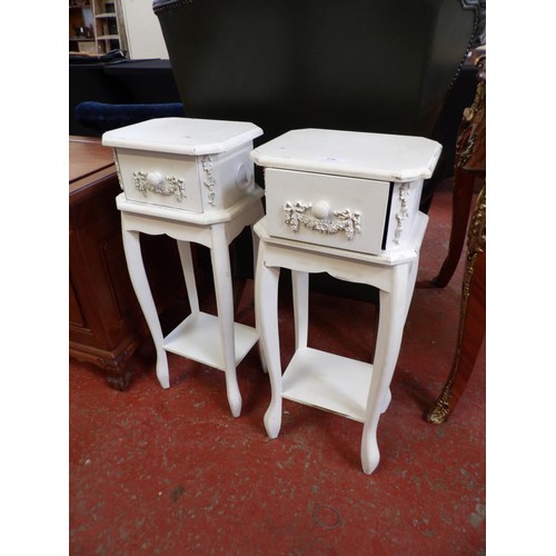 276 - A pair of white painted bedside tables fitted a drawer and an under tier