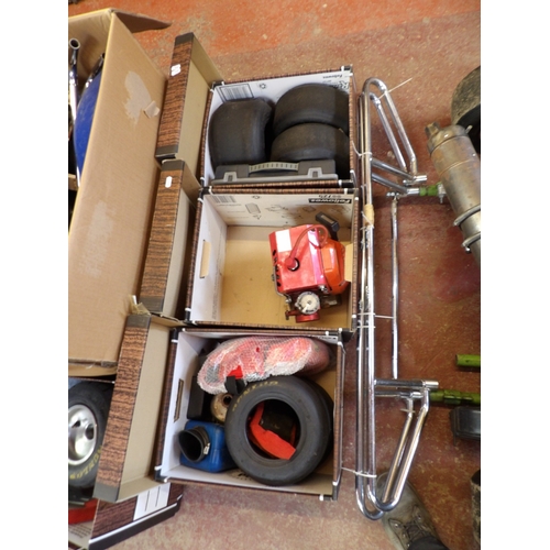 332 - A racing go-kart together with an enormous assortment of spares and accessories