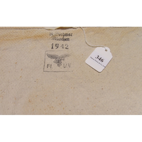 346 - A World War II Luftwaffe towel with insignias and dated 1942 with additional markings on the verso