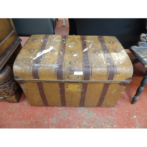 373 - A Victorian painted tin travelling trunk