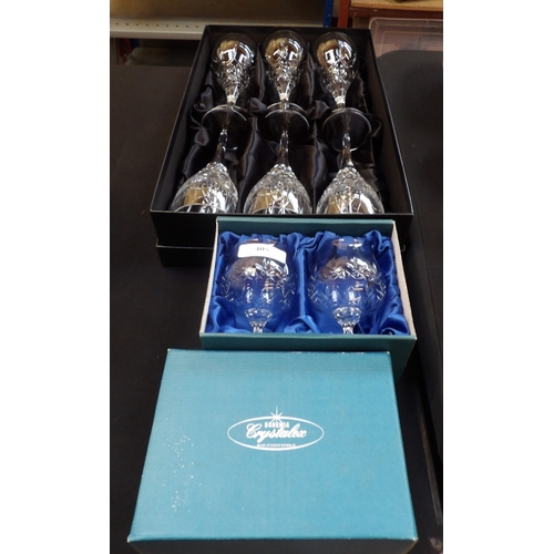 405 - A boxed set of six Royal Doulton hand cut crystal stemmed wine glasses together with a boxed pair of... 