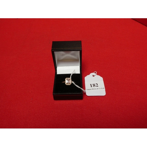 182 - An 18 carat yellow gold emerald cut stone with 52 diamond surround ring (size L)