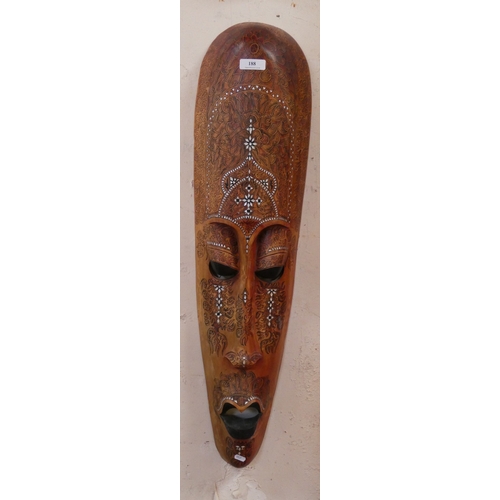 188 - A large ethnic face mask