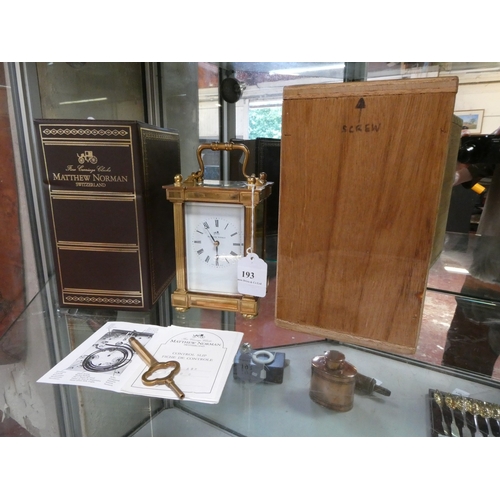 193 - A brass cased carriage clock by Matthew Norman of Switzerland