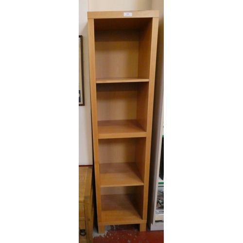 223 - A four tier narrow bookcase
