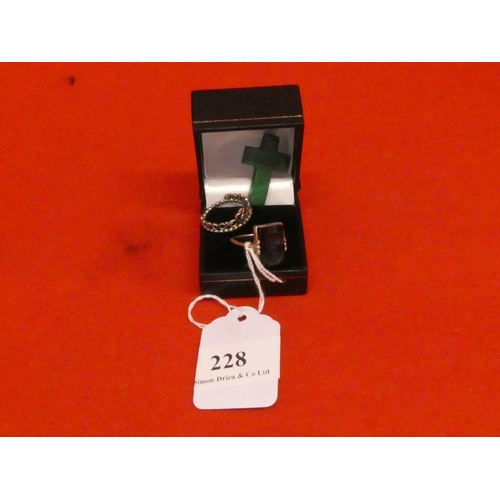 228 - A black jade ring together with another ring modelled in the form of a tiara and a jade cross