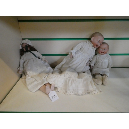 230 - Three vintage porcelain faced dolls