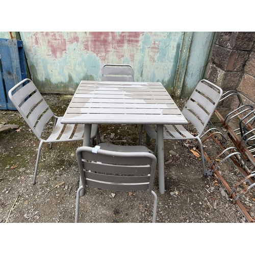 71 - A metallic garden table of square form together with four chairs