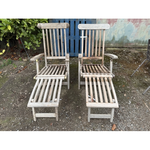 72 - A pair of teak steamer chairs
