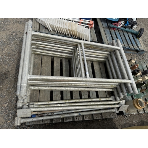 106 - Ten aluminium scaffold tower sections and associated bars