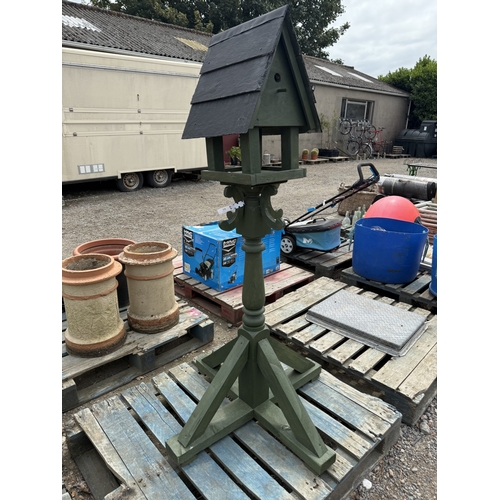 115 - A wooden bird table with integrated nest box and slate roof