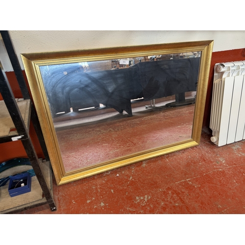 224 - A gilt framed mirror