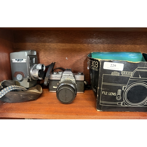 229 - A mid century cine camera together with a similar Minolta SRT3036 camera