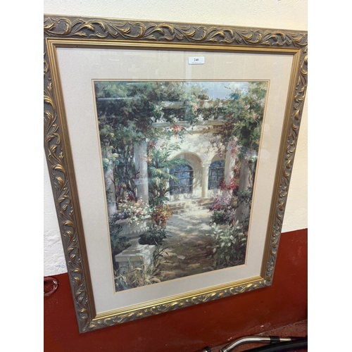 240 - A pair of large gilt framed prints each depicting a villa and garden