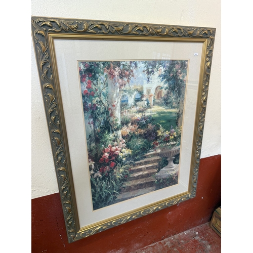 240 - A pair of large gilt framed prints each depicting a villa and garden