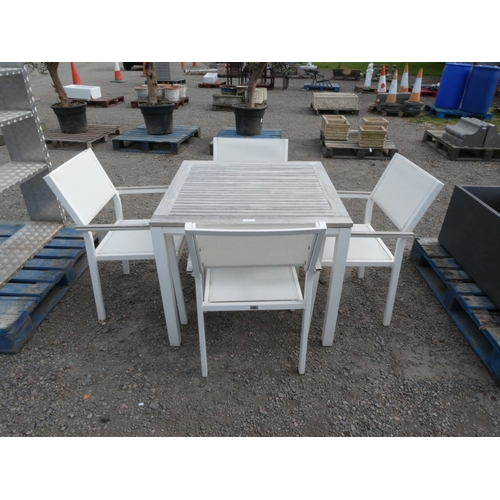 68 - A Gloster white metallic and teak garden table together with four matching chairs
