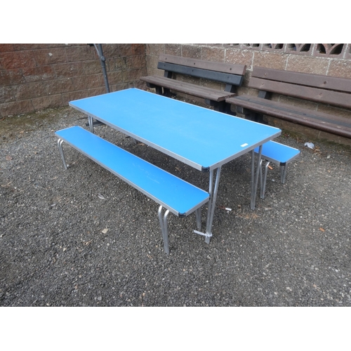 76 - A folding picnic table together with two matching benches