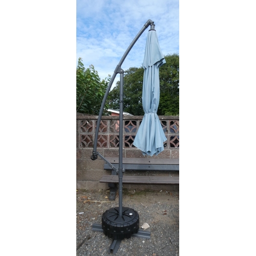 77 - A Supremo Leisure parasol with ballastable base