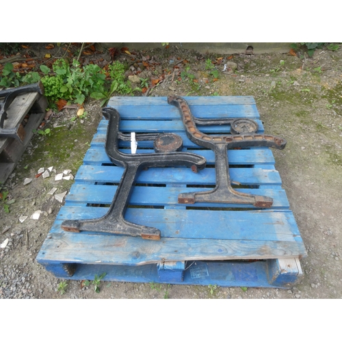 99 - A pair of substantial cast iron bench ends