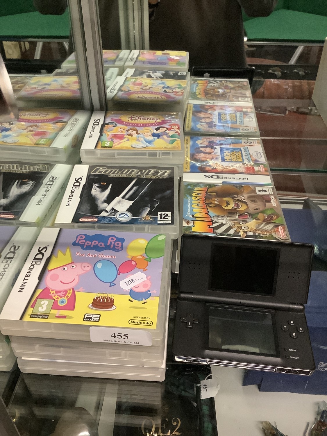 A Nintendo DS Lite portable games console together with a large ...