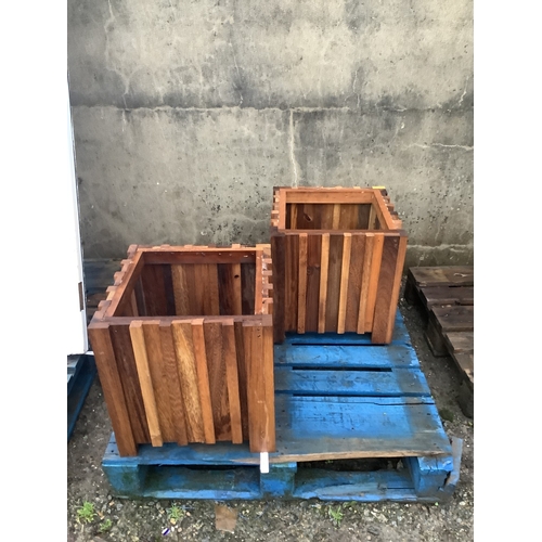 61 - A pair of hard wood planters of square form