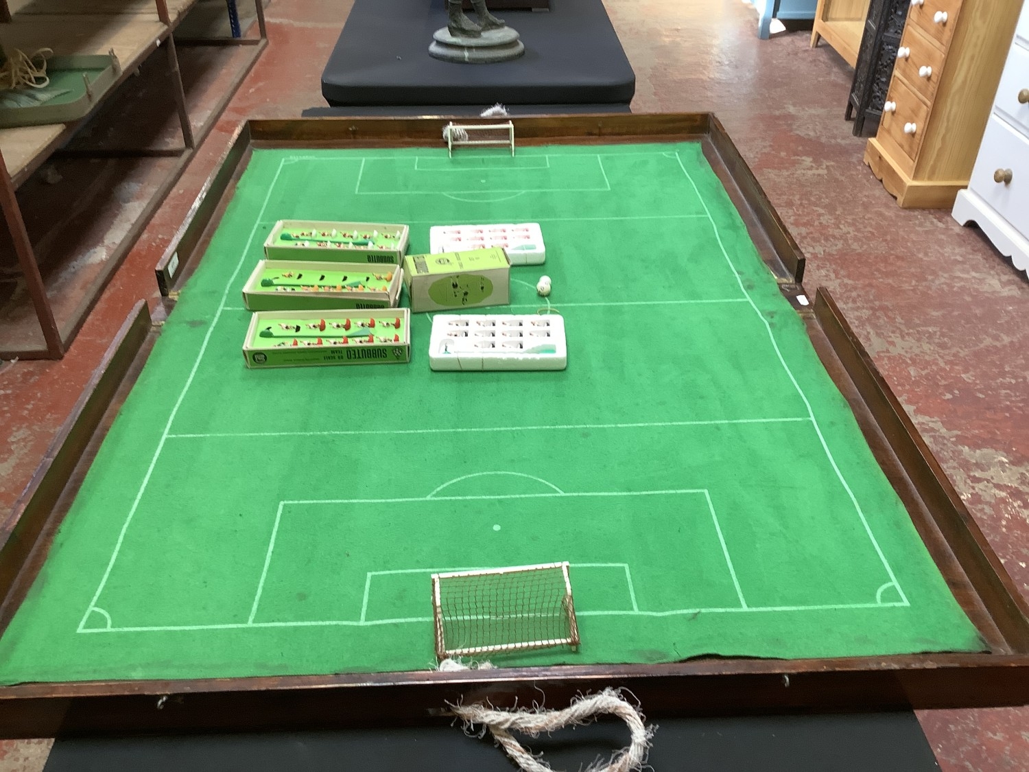 A vintage folding Subbuteo football pitch table together with various ...