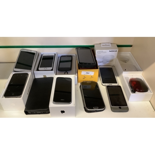 An assortment of mobile telephones and accessories