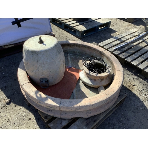 29 - A reconstituted stone water feature of circular form complete with pump